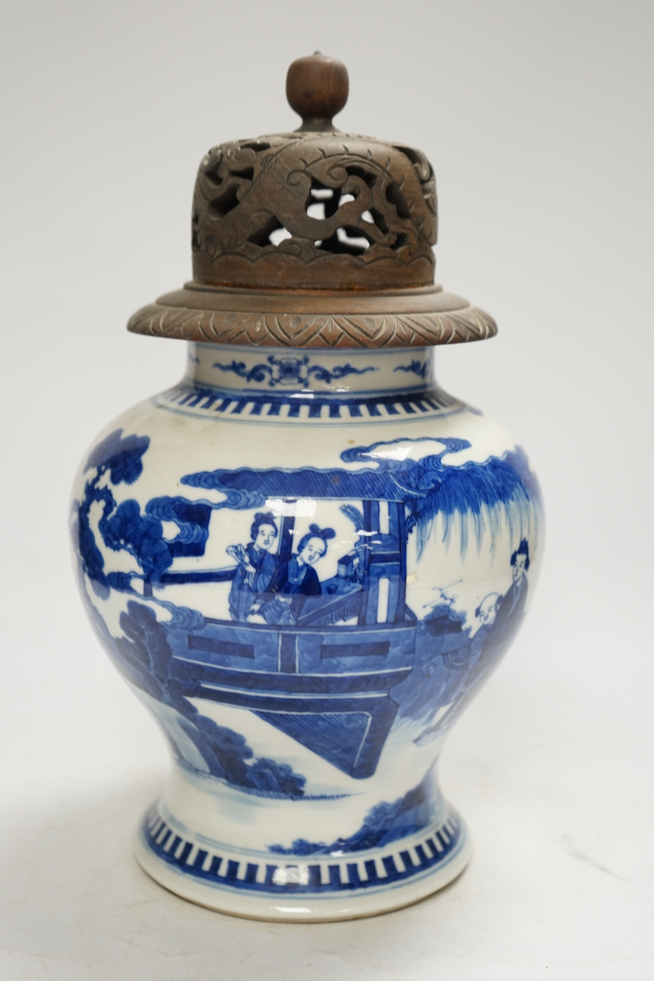 A 19th century Chinese blue and white baluster jar, painted with a scene from the Romance of the Western chamber, wood cover, 34cm. Condition - good